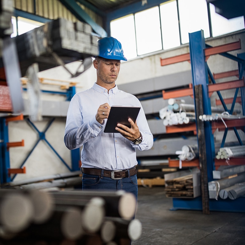 Architect working at table on tablet