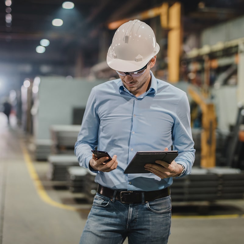 Architect working at table on tablet
